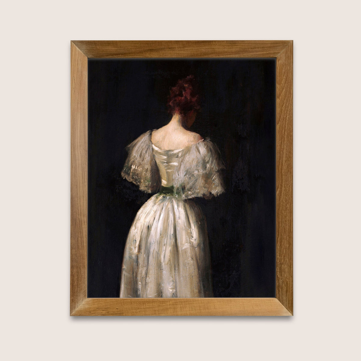 Framed female portrait print against a dark background, in a wooden frame on a white wall.