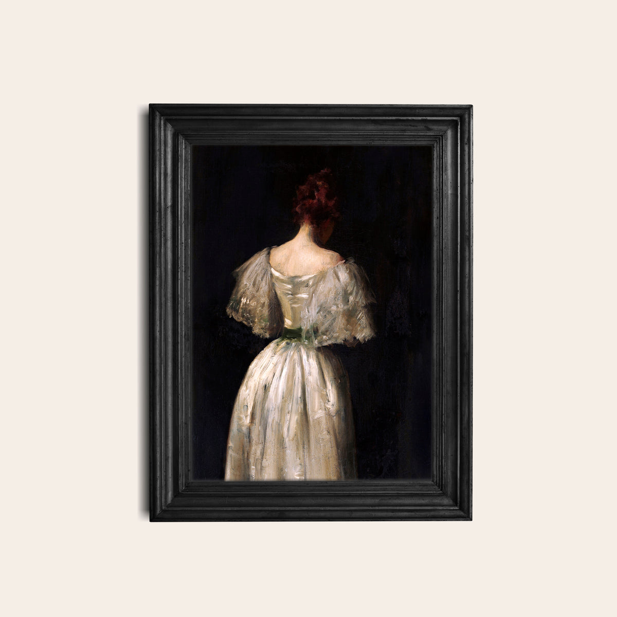 Framed female portrait print hanging on a white wall in a black frame.