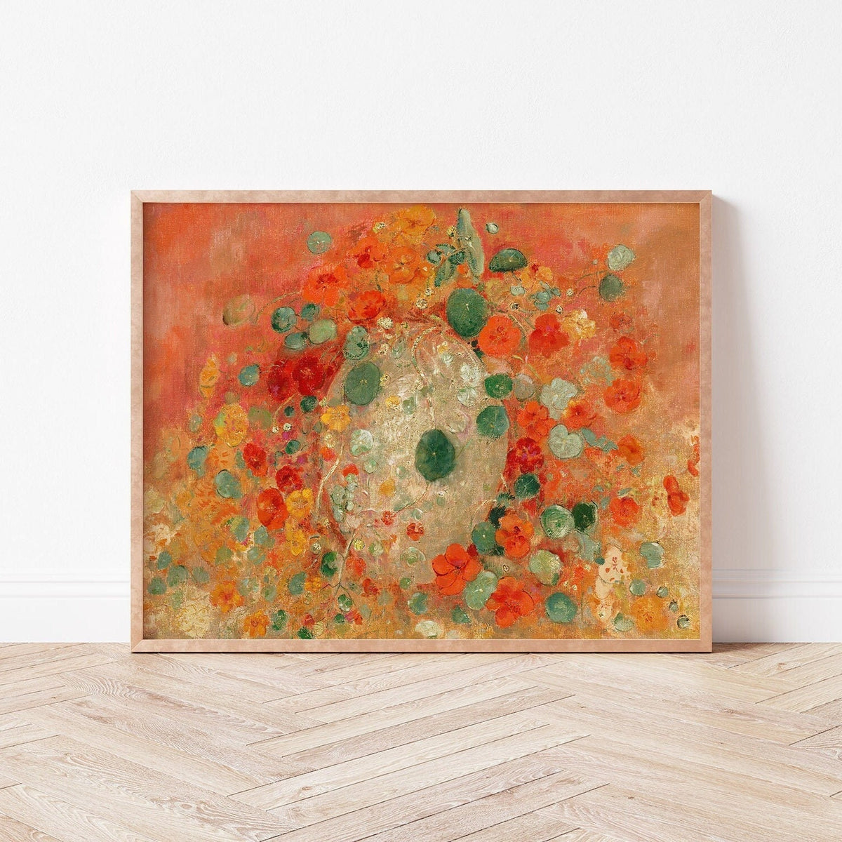 A fine art print of Odilon Redon's oil painting, Nasturtiums, from 1905, framed and displayed in a simple light wood picture frame against a white wall.