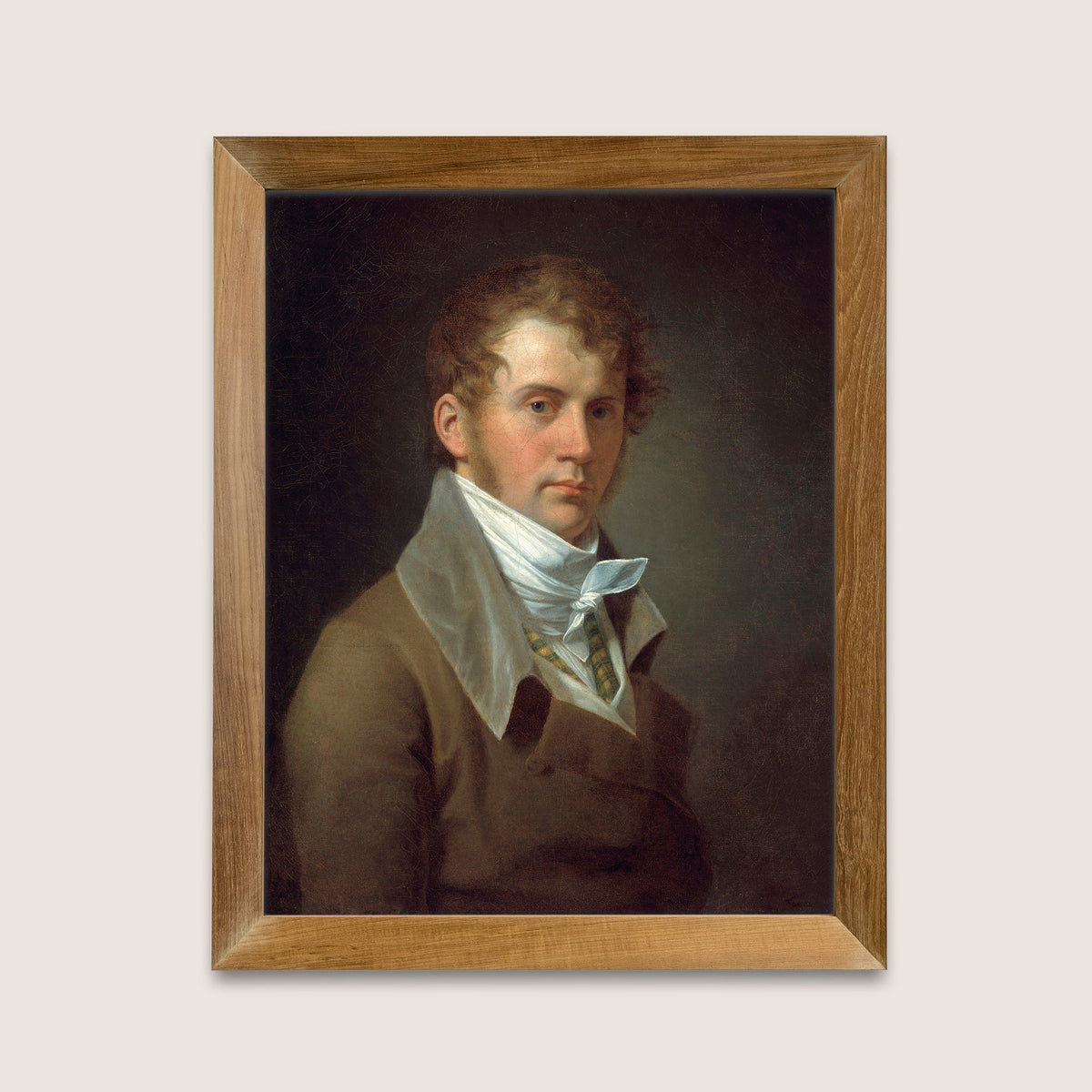 Framed portrait of a man with a white cravat on a light gray background