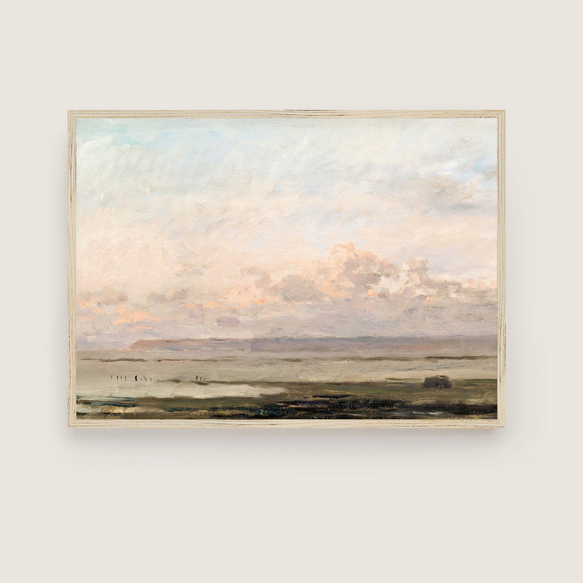 Framed print of a landscape with a pastel sky and fields on a white wall