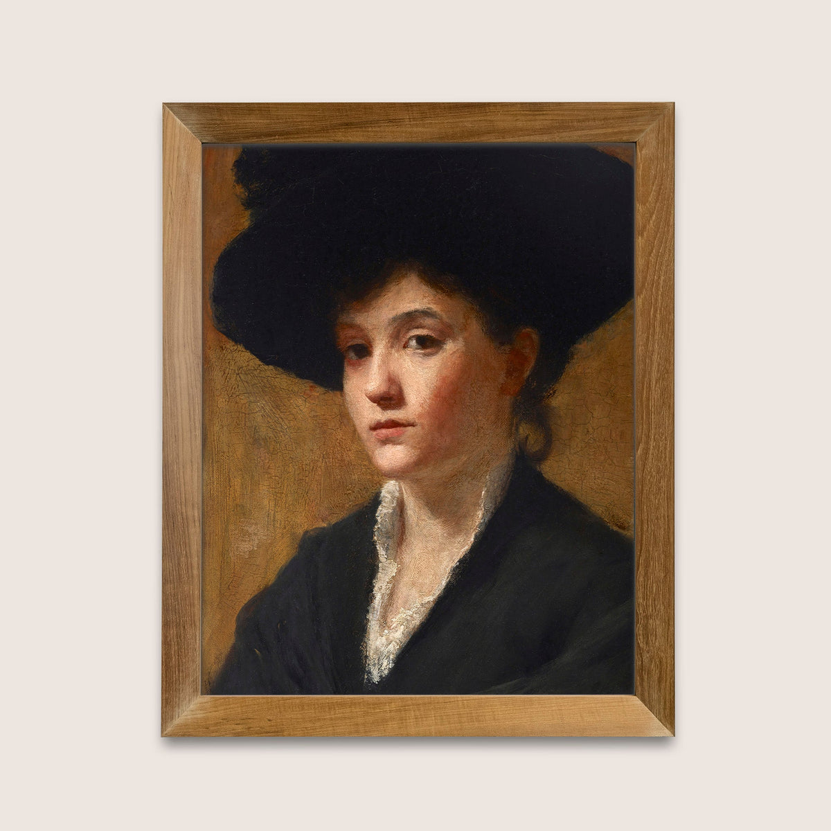 Framed portrait painting of a person wearing a dark hat and coat, hung on a light background