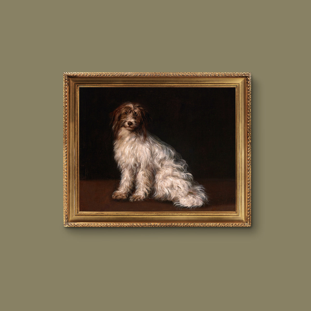 Gold framed artwork of a terrier dog painted on a dark background, hanging on a sage green wall.