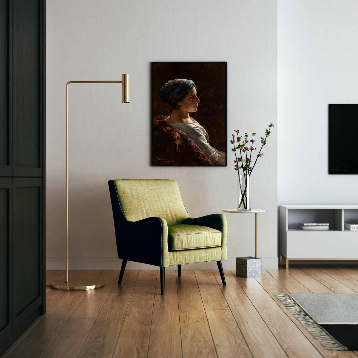 A framed female portrait print hung above a green chair in a modern living room.