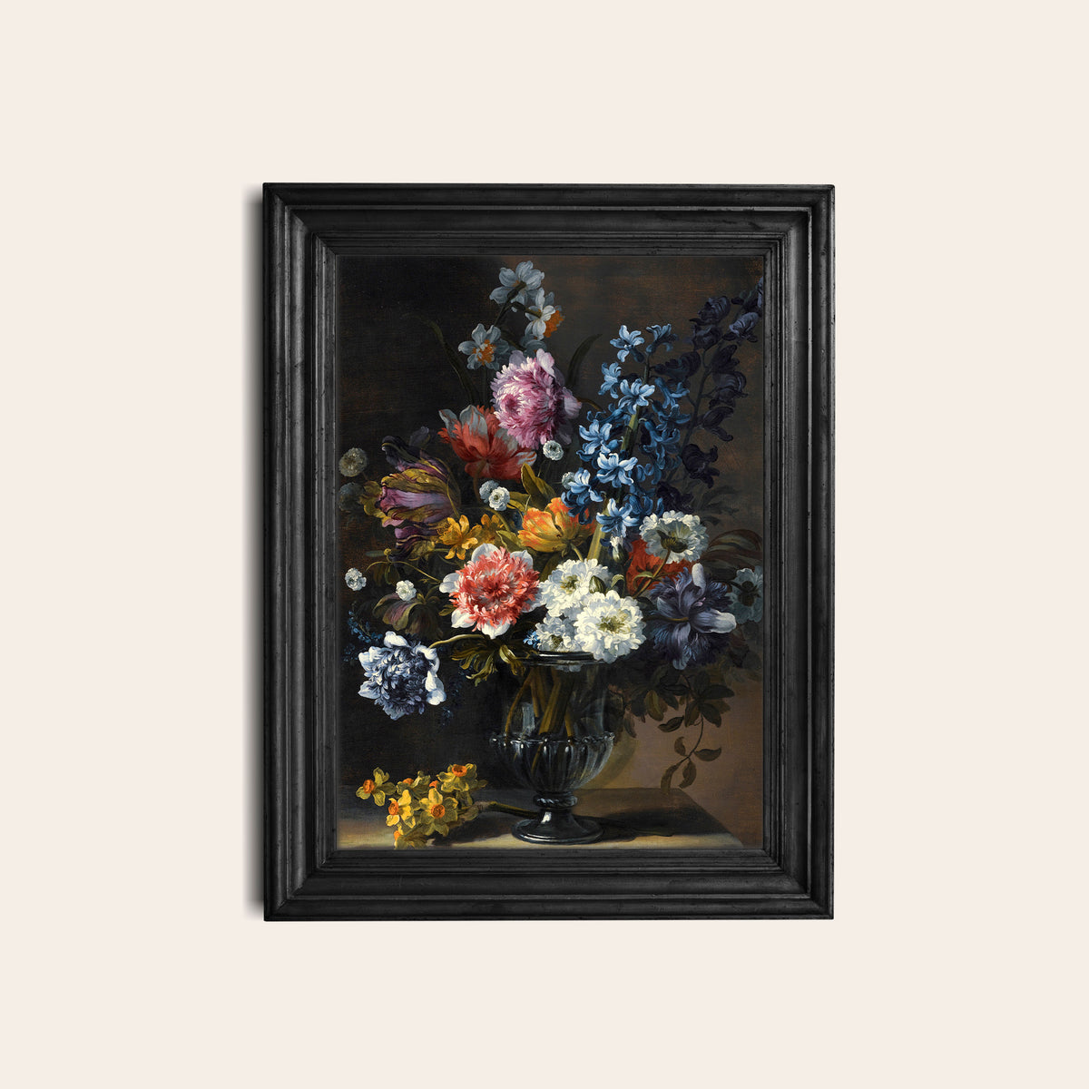 Framed floral print in a black frame on a white wall.
