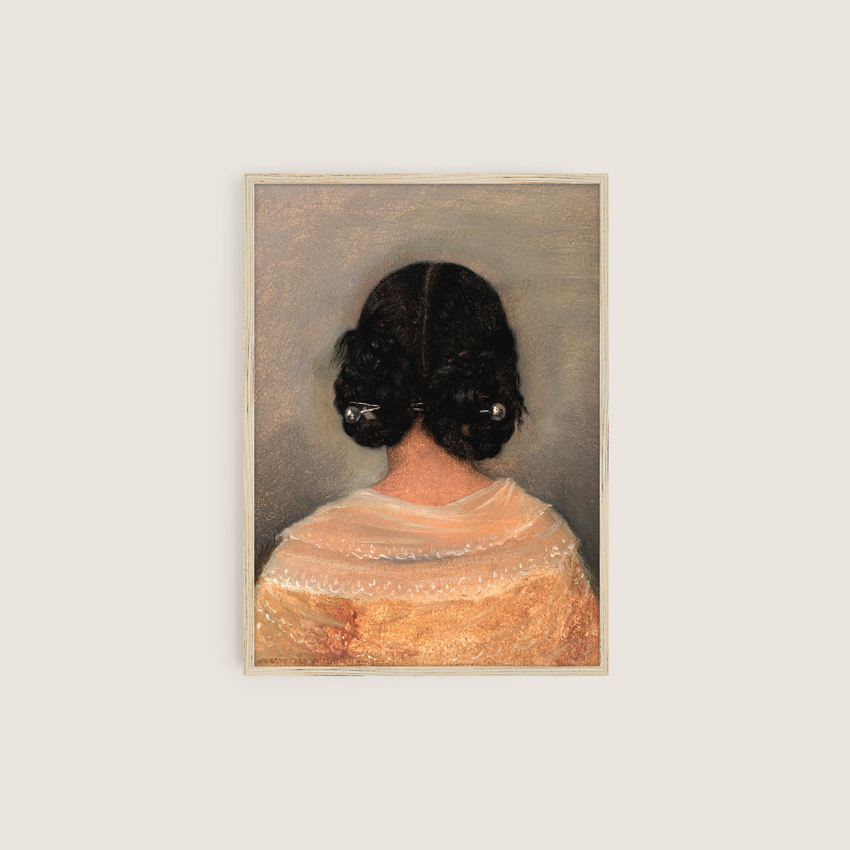 Framed artwork of a woman from behind with dark hair on a light grey background hung on a cream wall in a wooden frame.