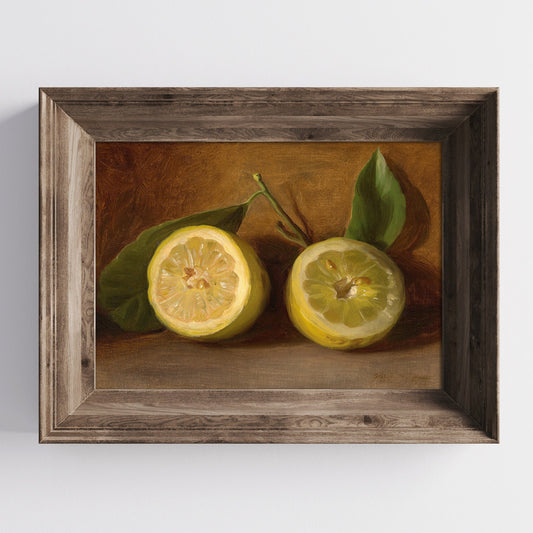 A fine art print of a 19th-century oil still-life painting of a halved lemon. The print is displayed in a wooden picture frame on a white wall.