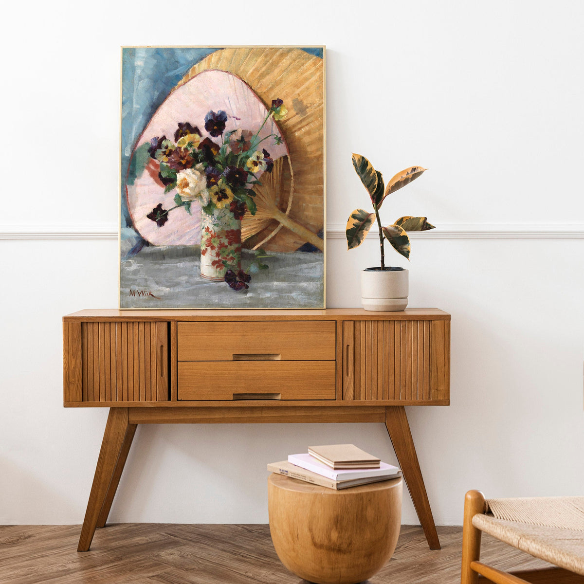 Wooden console table with a framed floral still-life on top, in a modern room setting.