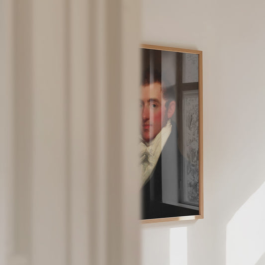 A video panning across a framed print of a male portrait.