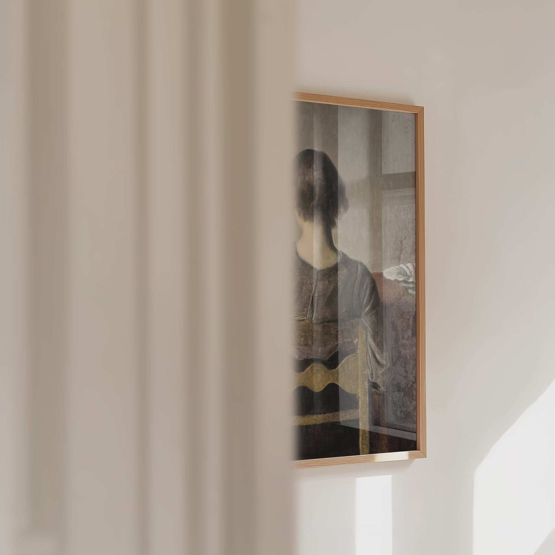 Video of a framed portrait of a female resting on a chair