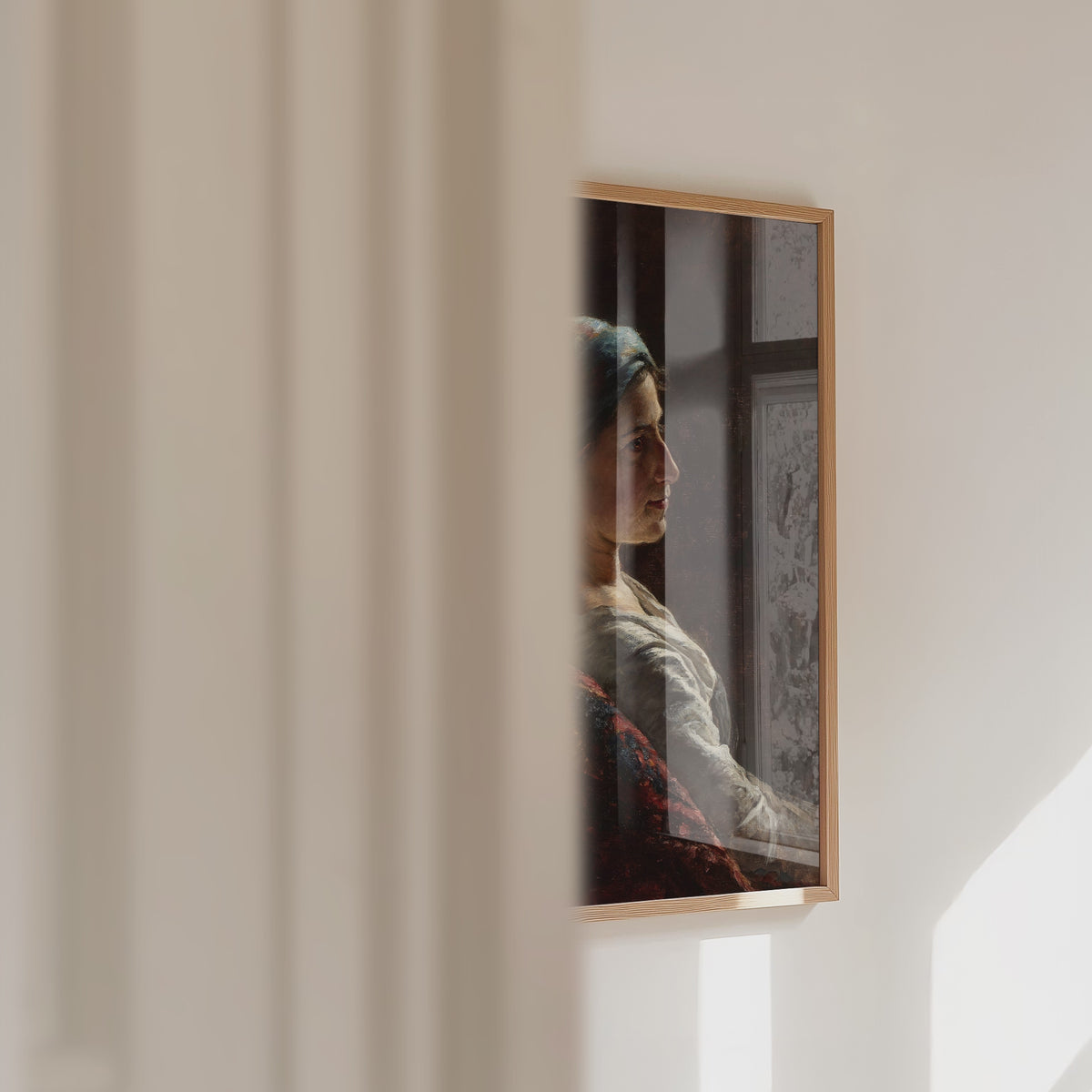 A video of a fine art print of an oil painting portrait hangs on the wall. The video sweeps past a wall with the framed print in view, with a window reflection.