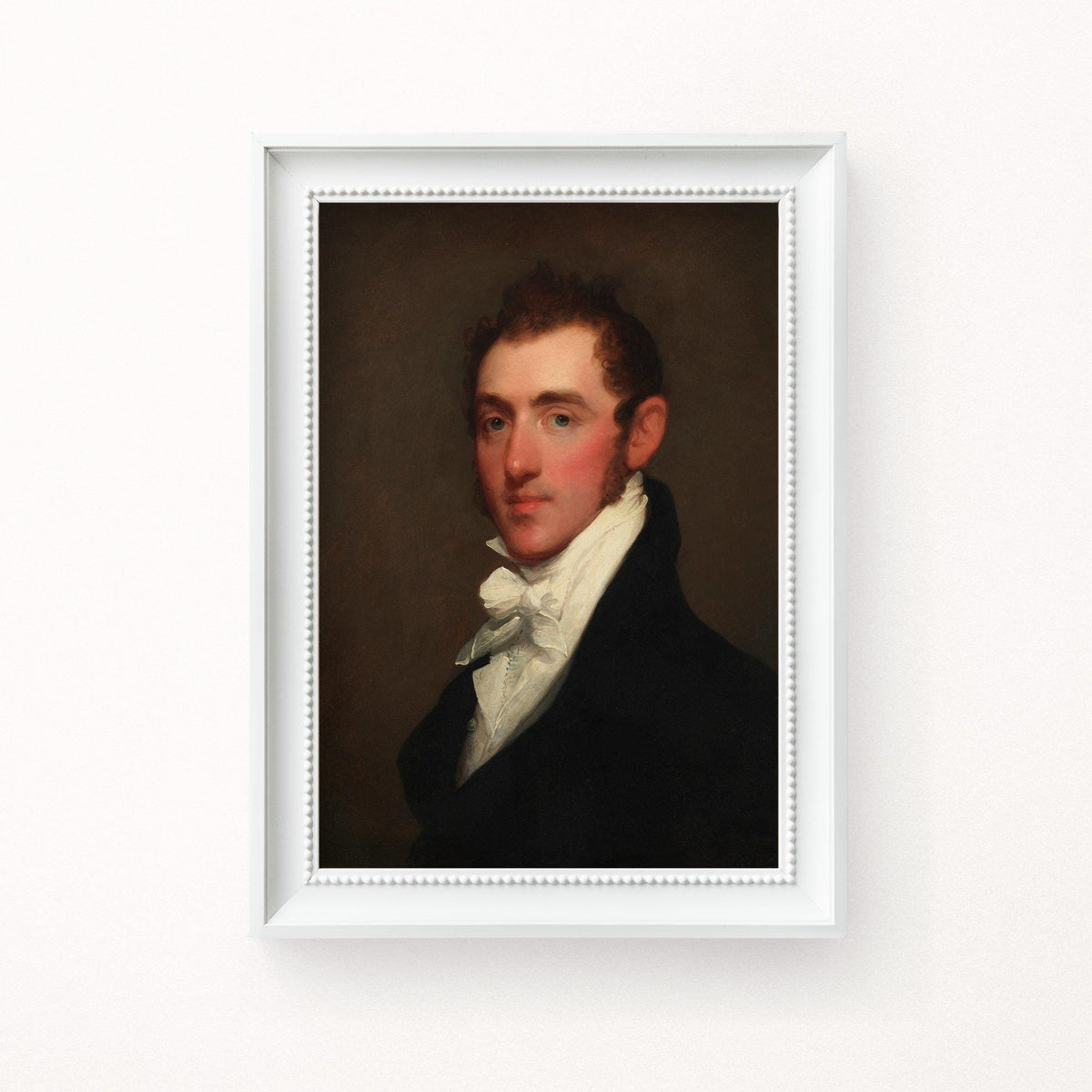 A fine art print of a Regency-era gentleman. The print is displayed hanging on the wall in a white wood picture frame.