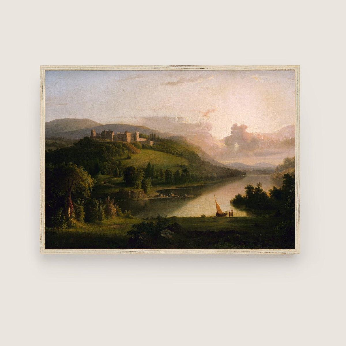 Framed artwork of a landscape with a castle, river, and boat on a white wall.