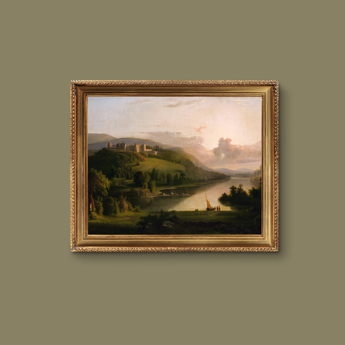 Framed landscape painting of a river scene with hills and a castle on a green wall.