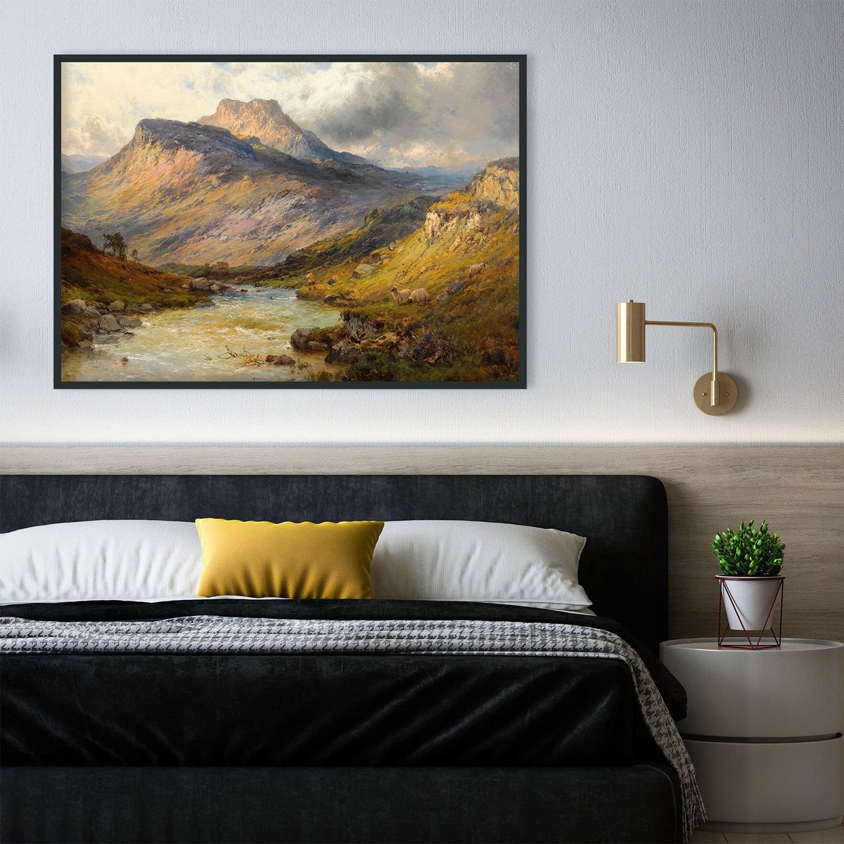 A fine art print of an oil painting depicting dramatic scenery and beautiful sunlight hitting the hills around Ben Lomond in Scotland. The print is displayed in a thin dark frame above a bed.