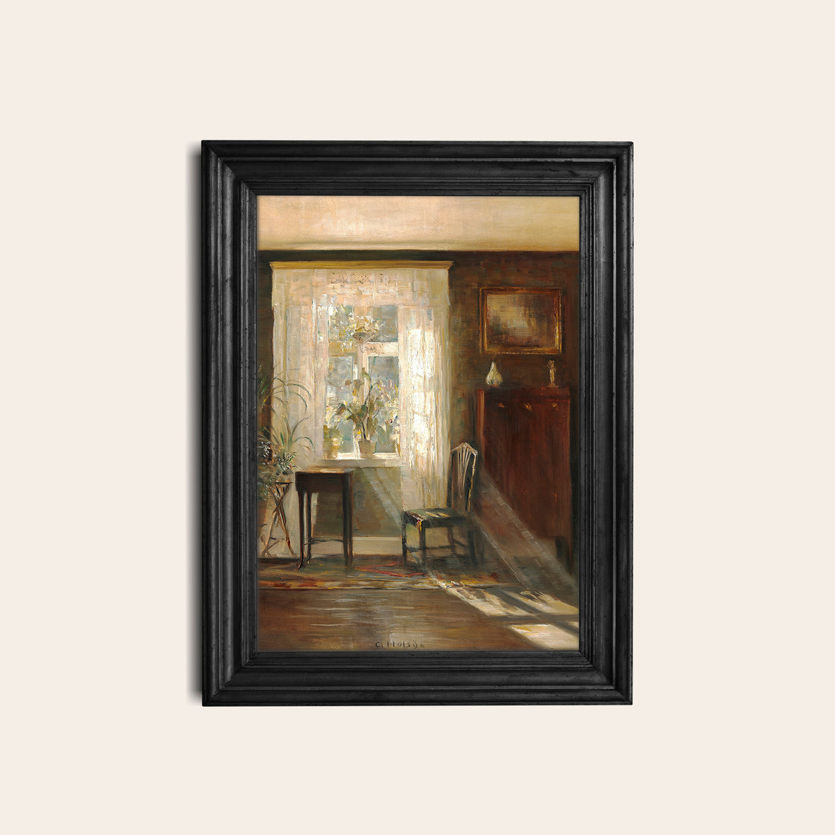 Framed print of an interior scene with a chair and table in a black frame on a white wall.